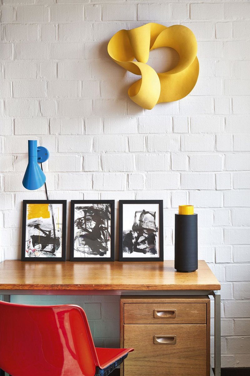On the wall hangs the Infinity Yellow Wall Sculpture by Meriti Rasmussen, inspired by the Mobius Ring.  , Jan Verlind
