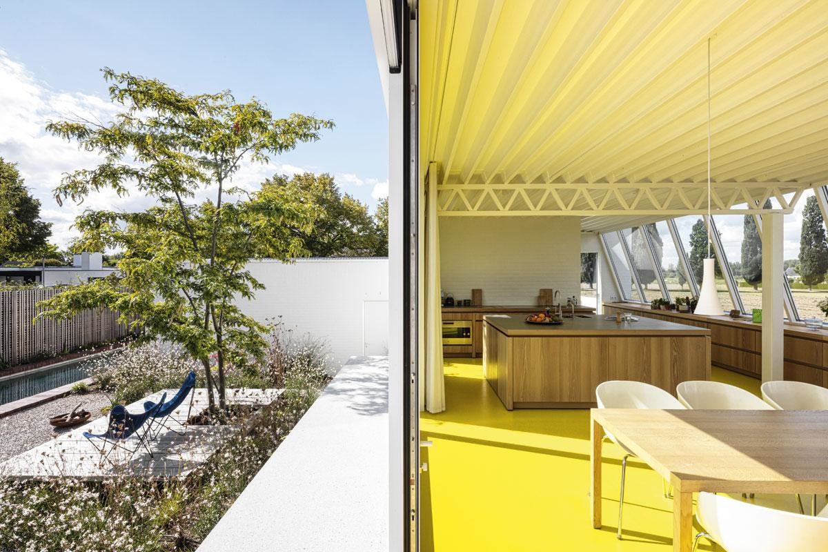 The yellow color of the floor in this home is very reflective.  Brings a sunny feel to Tim Van de Velde's home