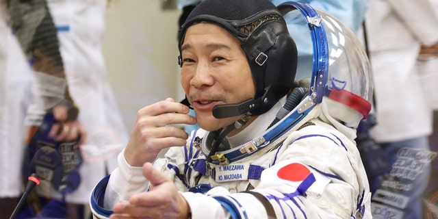 Spaceflight participant Yusaku Maezawa of Japan glimpses before launch at Russia's chartered Baikonur Cosmodrome, Kazakhstan, Wednesday, Dec. 8, 2021. 