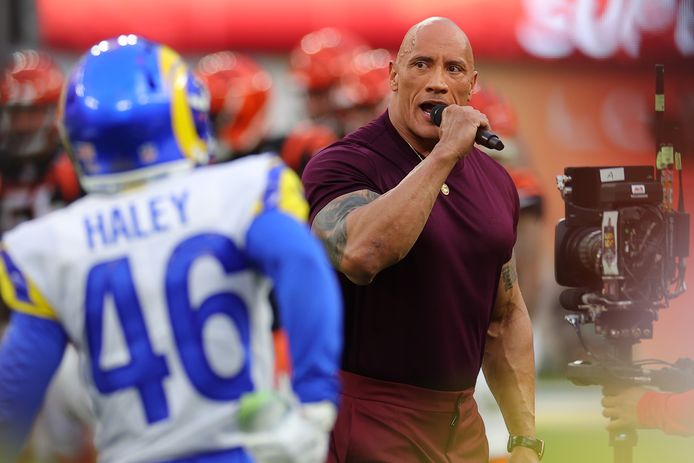 Dwayne "the rock" Johnson introduces the WWE-style teams, the Los Angeles Rams and the Cincinnati Bengals, at the Super Bowl in Los Angeles.