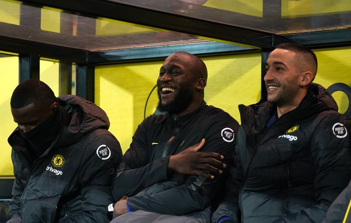 Lukaku smiling on the bench next to Ziyech in Norwich.