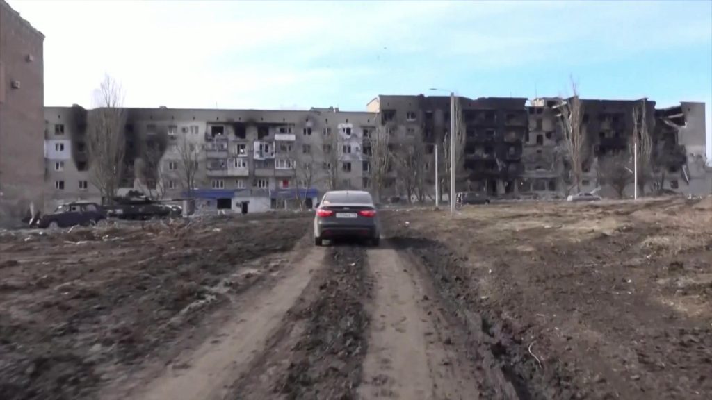 Journalist drives through a completely destroyed city in eastern Ukraine