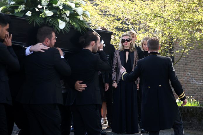Members of The Wanted carry the coffin of Tom Parker and his wife on the right.
