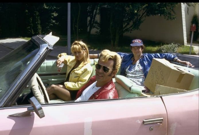 The Fluder family in a pink Chevrolet.