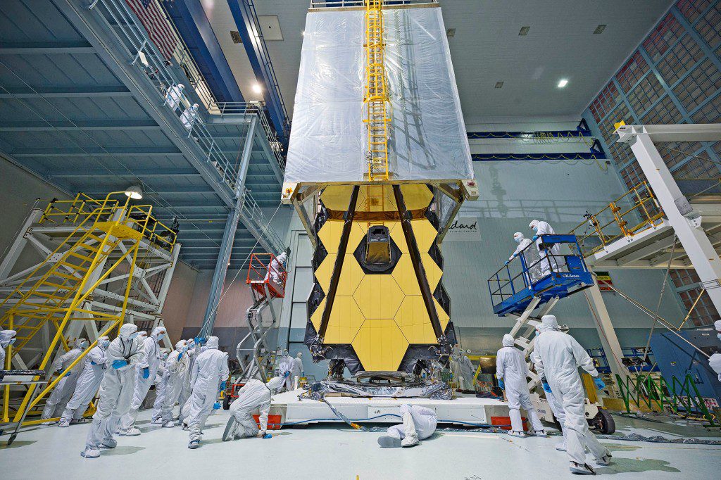 What looks like a science fiction teleporter being positioned atop NASA's James Webb Space Telescope is actually: "Clean tent." The