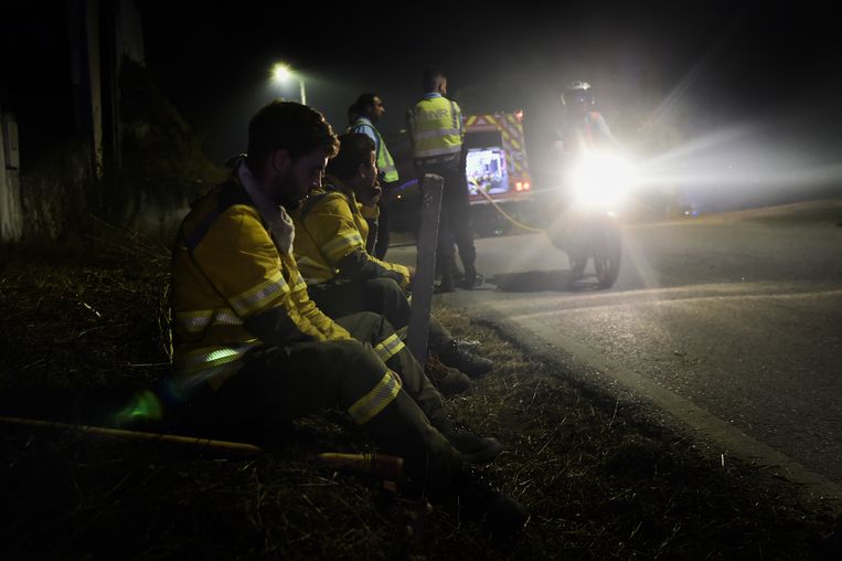 A firefighter rests as wildfires continue to wreak havoc in the Portuguese village of Leiria.  Image by ANP / EPA