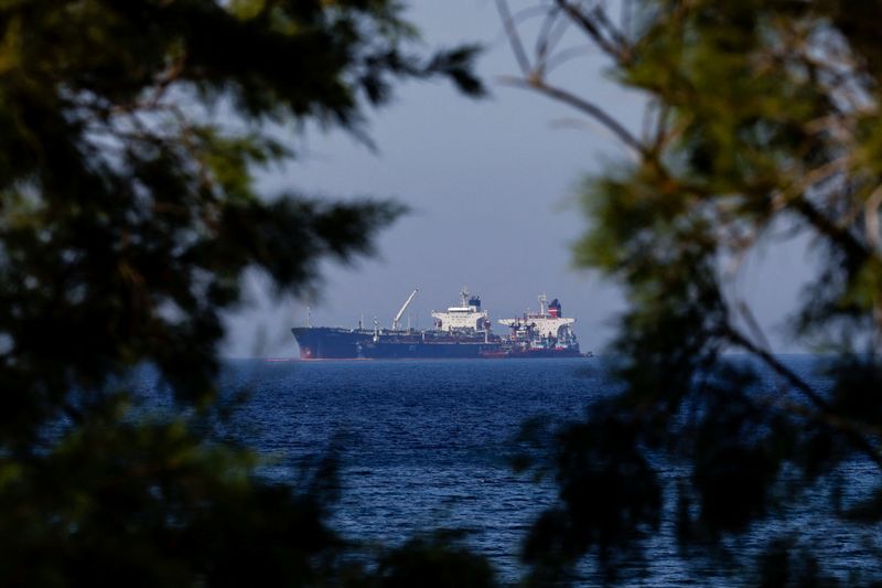 FILE PHOTO: The Liberian-flagged oil tanker Ice Energy transfers crude oil from the Iranian-flagged oil tanker Lana off the shore of Karystos