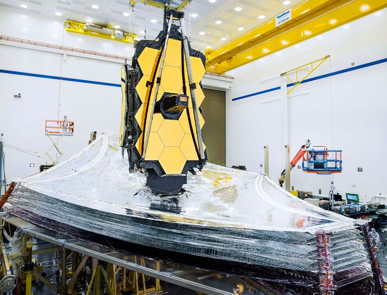 James Webb Space Telescope for Ground Launch.  The main gold mirror is still folded here.  A multi-layer heat shield - the size of a tennis court - is visible below.  NASA/Kris Jean image