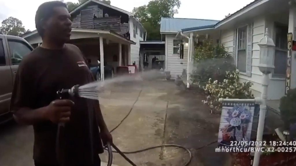Black priest caught watering flowers