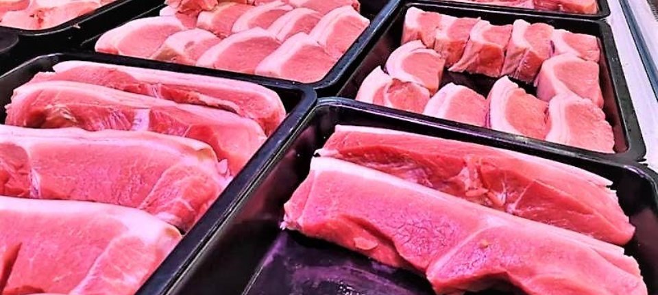 US pork exports to China cut in half