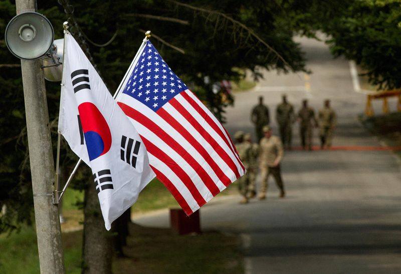 FILE PHOTO: FILE PHOTO: American and South Korean flags at Yongin South Korea