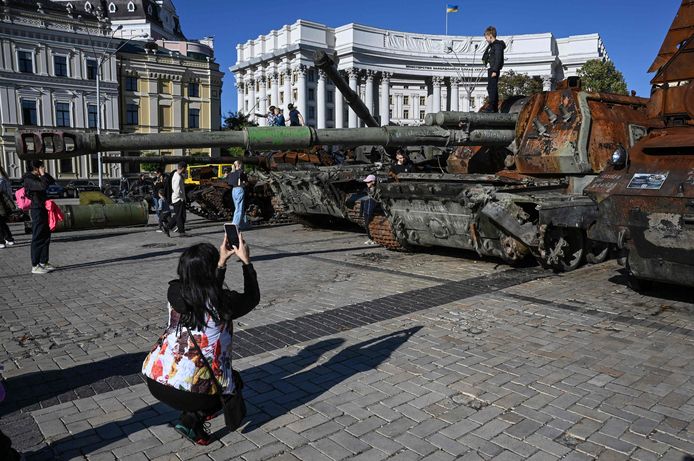Children pose for pictures on wrecked Russian tanks on display in Kyiv.  Photo from October 6th.