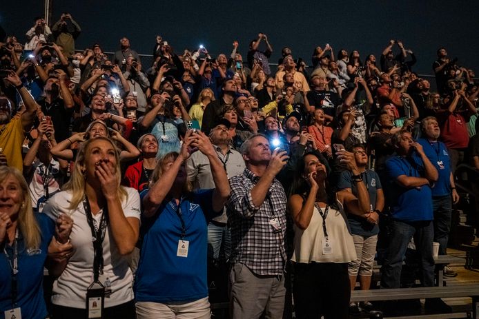 In this image provided by NASA, guests at Banana Creek watch the launch of a NASA Space Launch System rocket carrying the Orion spacecraft on the Artemis I test flight, Tuesday, November 2.  15, 2022, at NASA's Kennedy Space Center in Florida.  (Keegan Barber/NASA via Associated Press)