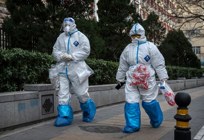 Chinese anti-epidemic workers wear suits to prevent the spread of the virus in Beijing.